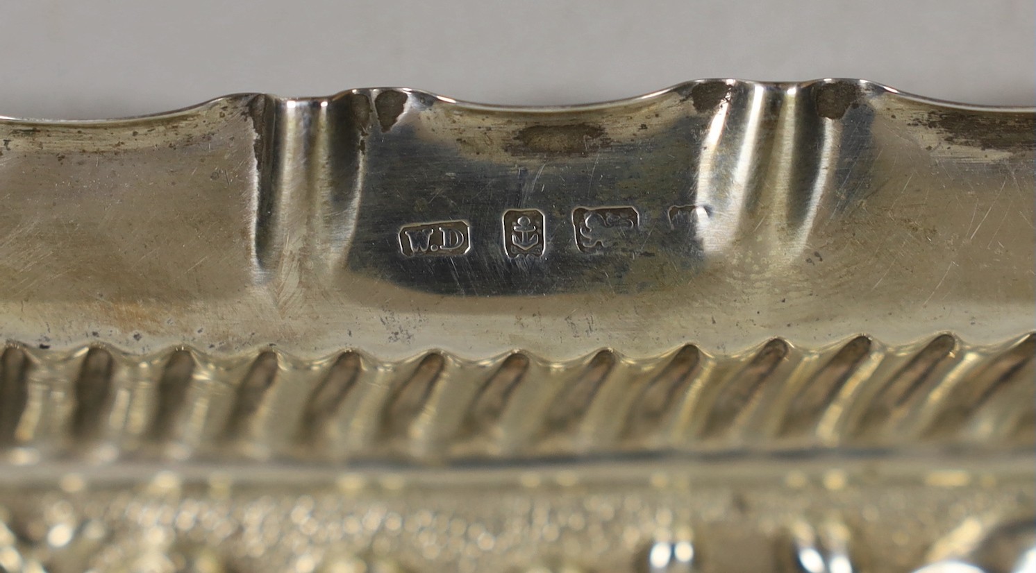 An Edwardian? repousse silver dressing table tray, maker, William Davenport, Birmingham, circa 1905, 27.2cm, 8.7oz.